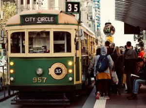 Passengers boarding the green number 35 tourist tram in Melbourne