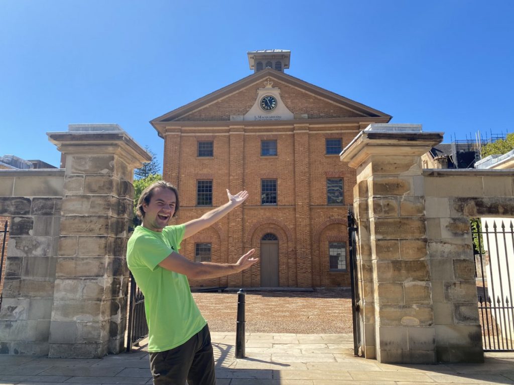 Sydney guide, Jake, standing outside Hyde Park Barracks
